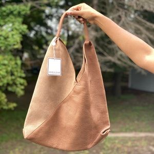 Brand new, mint condition pure leather hobo.